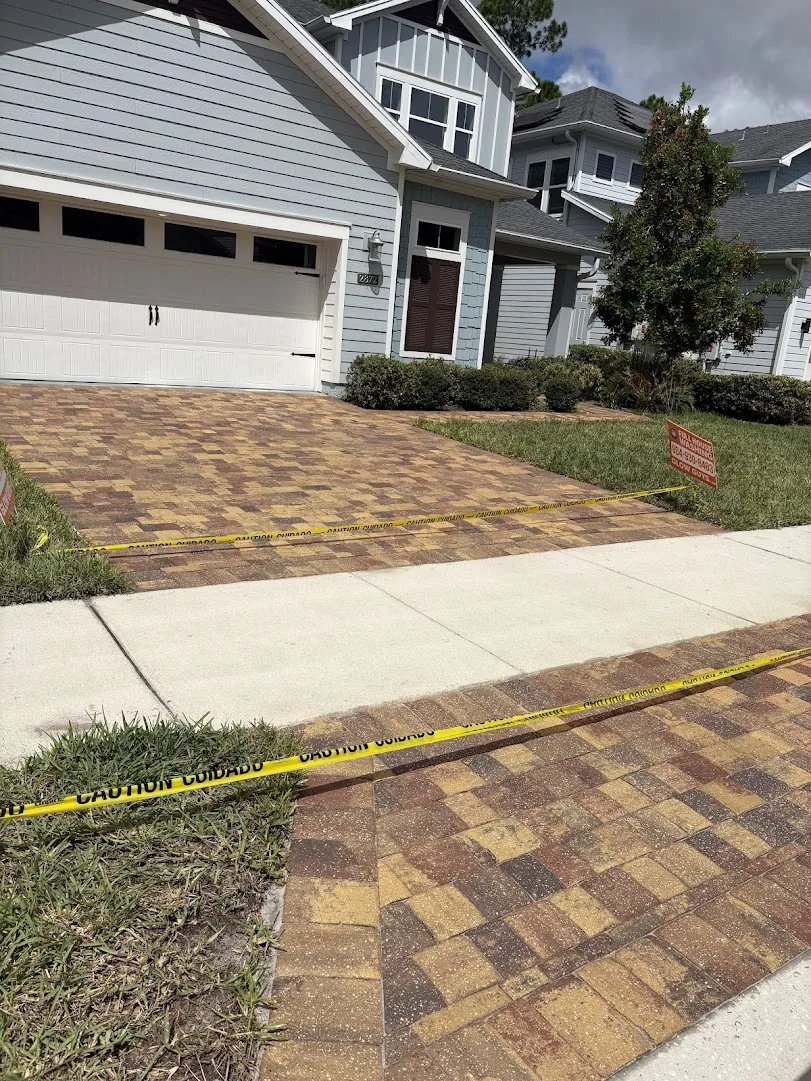 Paver driveway and walkway during a full paver cleaning at a Jacksonville home