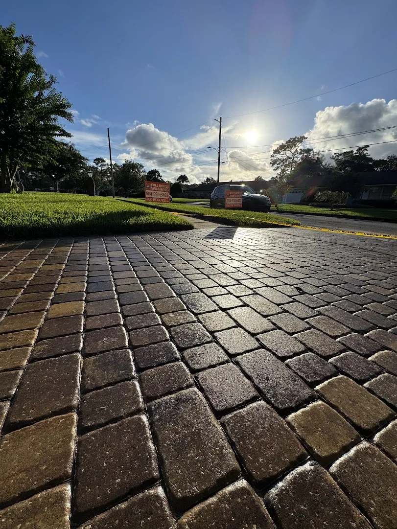 Paver driveway cleaned and sealed to a rich, even finish in Jacksonville, FL