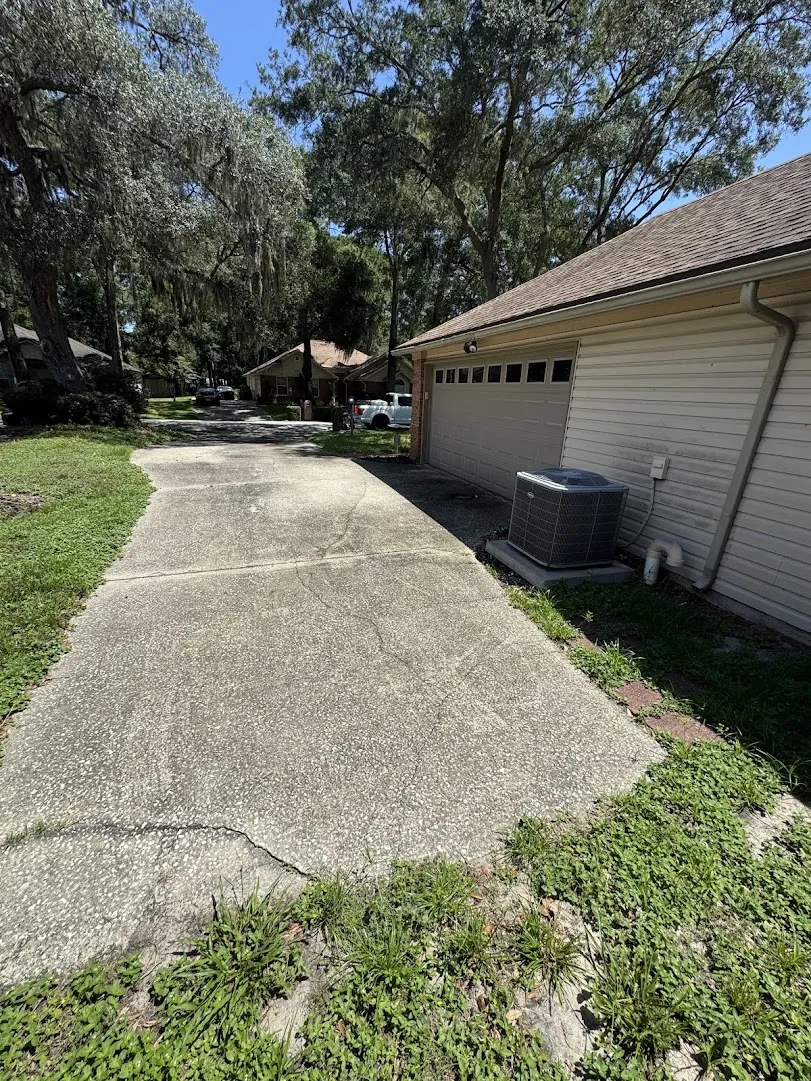 Front walkway and house exterior being rinsed during a full home wash